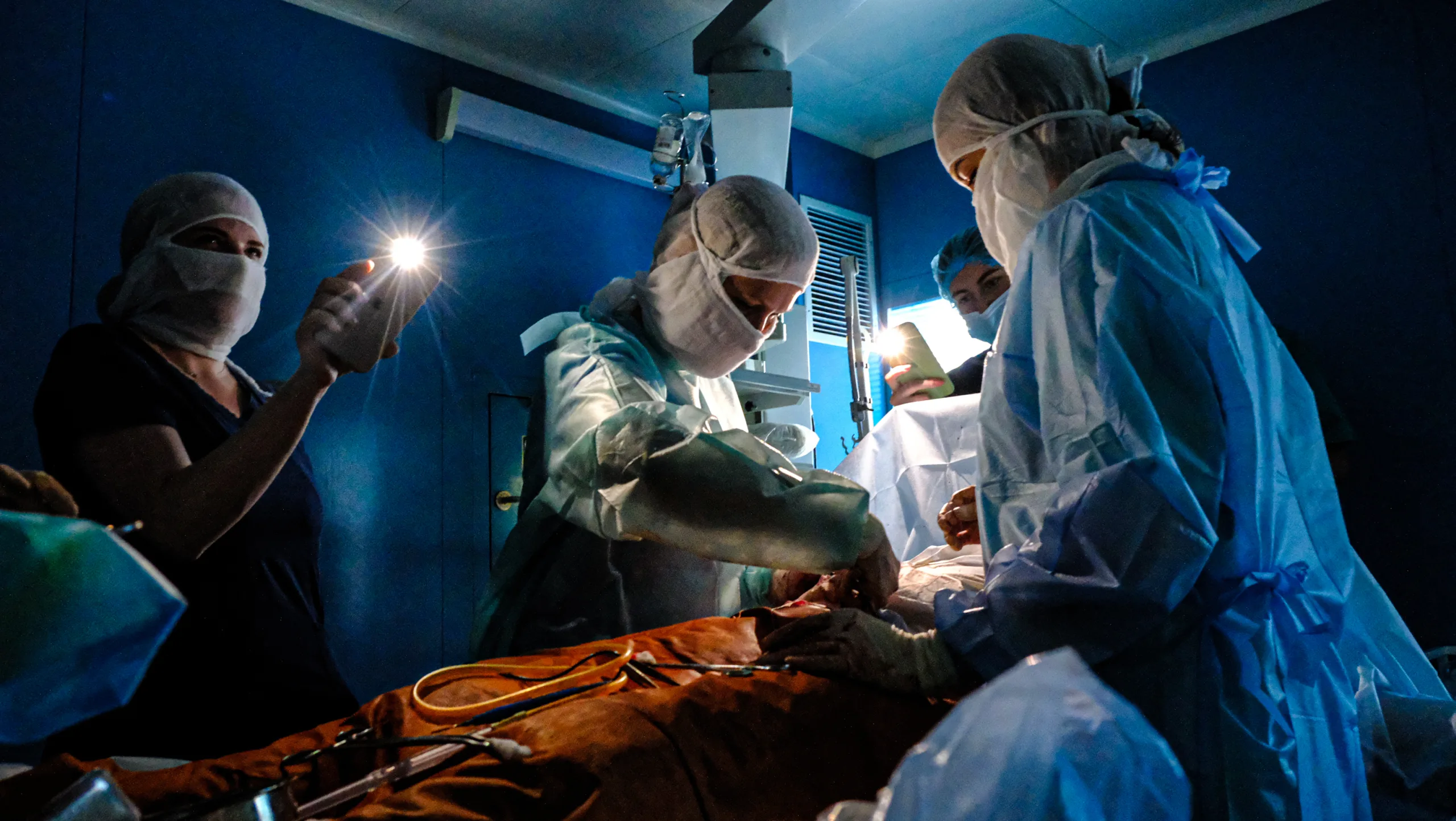 Surgery in the Dark: Ukrainian Doctors Adapt to Life-Saving Operations Amidst Relentless Power Cuts